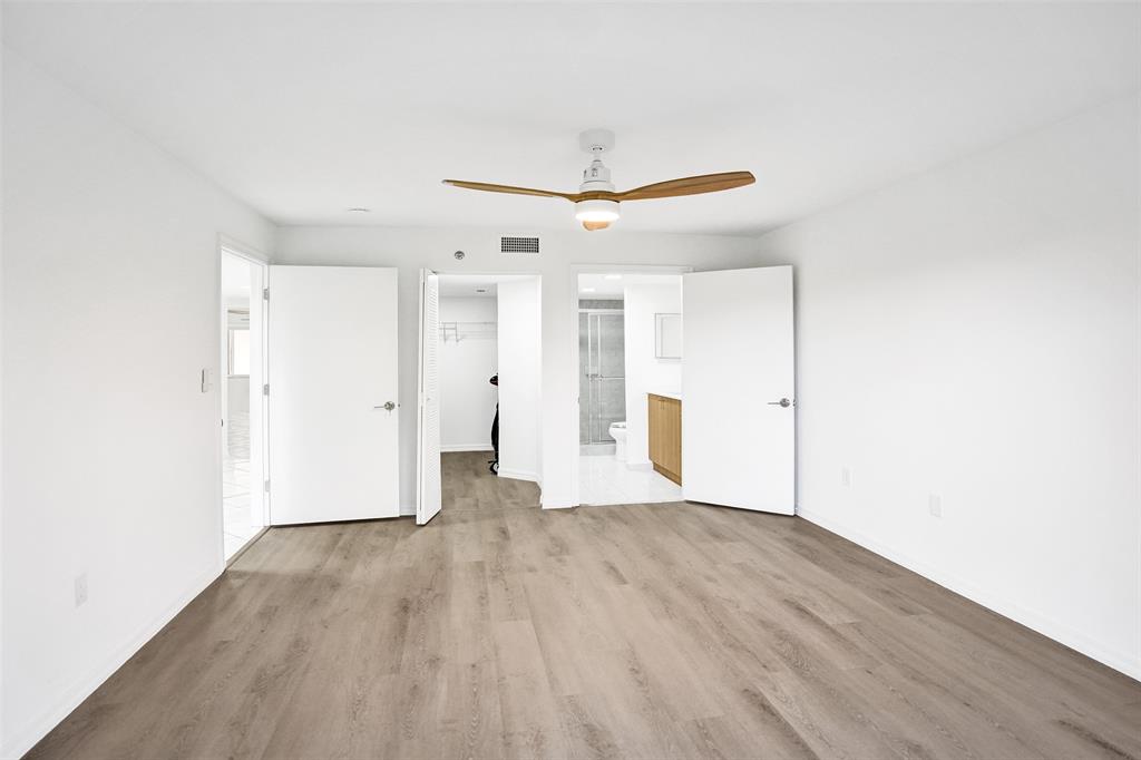 9470 Tangerine Place, Unit 404 Davie, FL 33324 - Photo 21 of 39 a view of an empty room with wooden floor