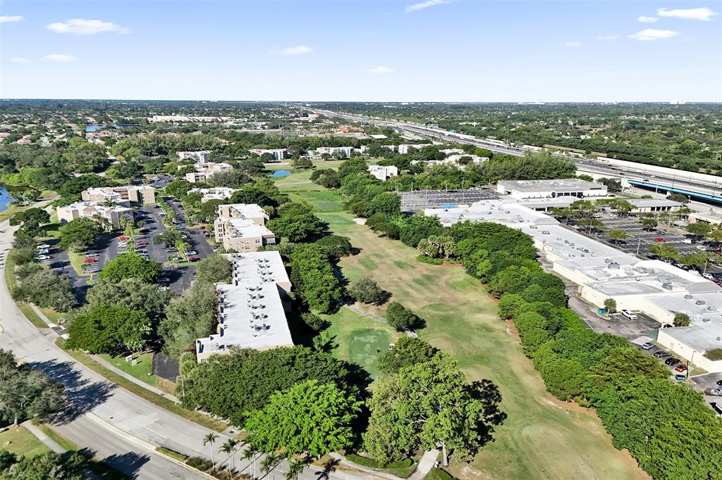 9470 Tangerine Place, Unit 404 Davie, FL 33324 - Photo 30 of 39 an aerial view of residential houses with outdoor space and trees
