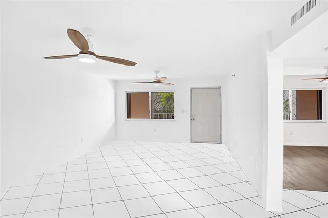 a view of an empty room and window