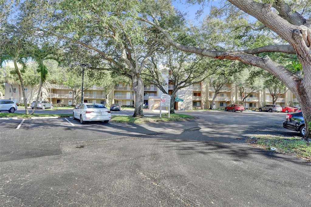 9470 Tangerine Place, Unit 404 Davie, FL 33324 - Photo 34 of 39 a view of road with card parked on side and road
