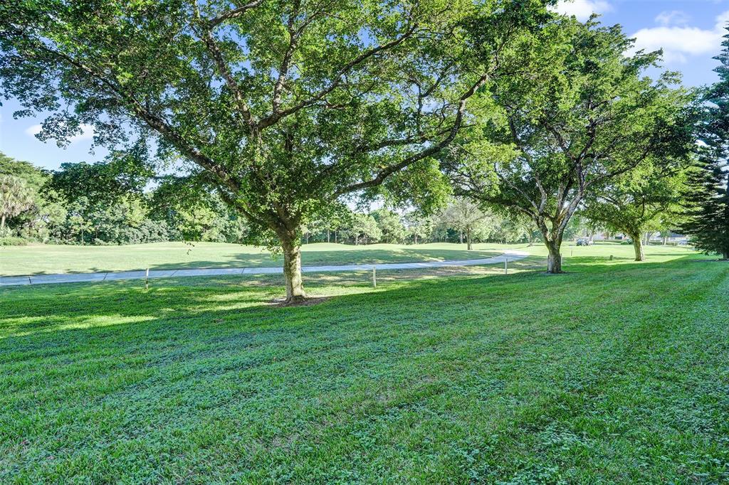 9470 Tangerine Place, Unit 404 Davie, FL 33324 - Photo 36 of 39 a view of grassy area with green space