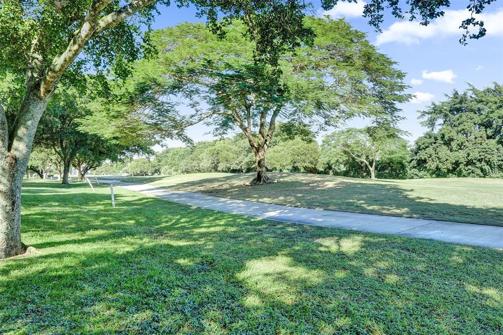9470 Tangerine Place, Unit 404 Davie, FL 33324 - Photo 38 of 39 a view of outdoor space with deck and yard