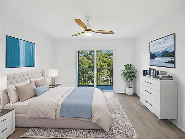 a spacious bedroom with a large bed and a window