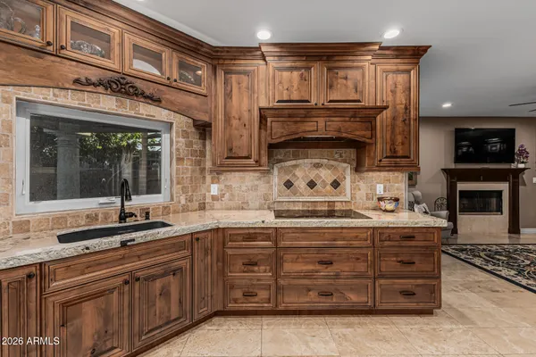a kitchen with a sink and cabinets