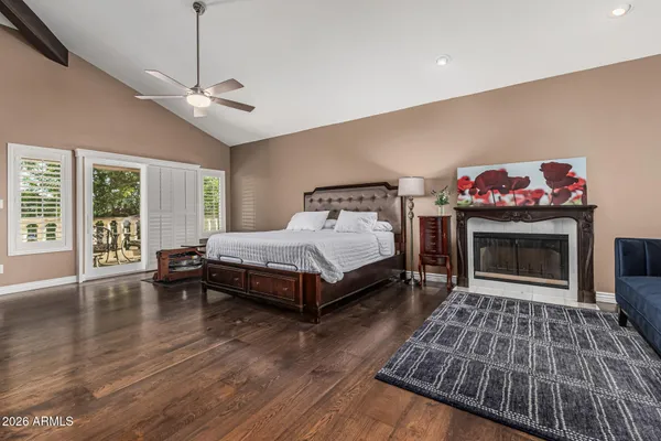 a bedroom with a bed and a fireplace