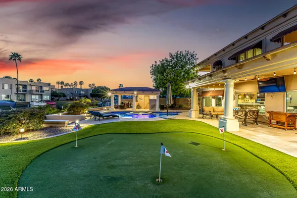 a view of a swimming pool with a table and chairs