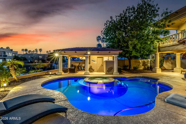 a view of a swimming pool with chairs