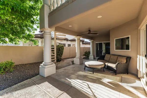 a outdoor space with a couch and chairs