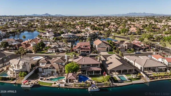 an aerial view of residential houses with outdoor space