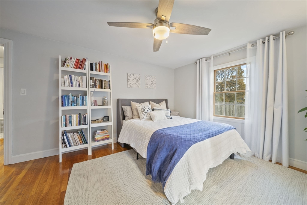 33 Ritchie Road Lynn, MA 01904 - Photo 13 of 39 a bedroom with a large bed and a book shelf