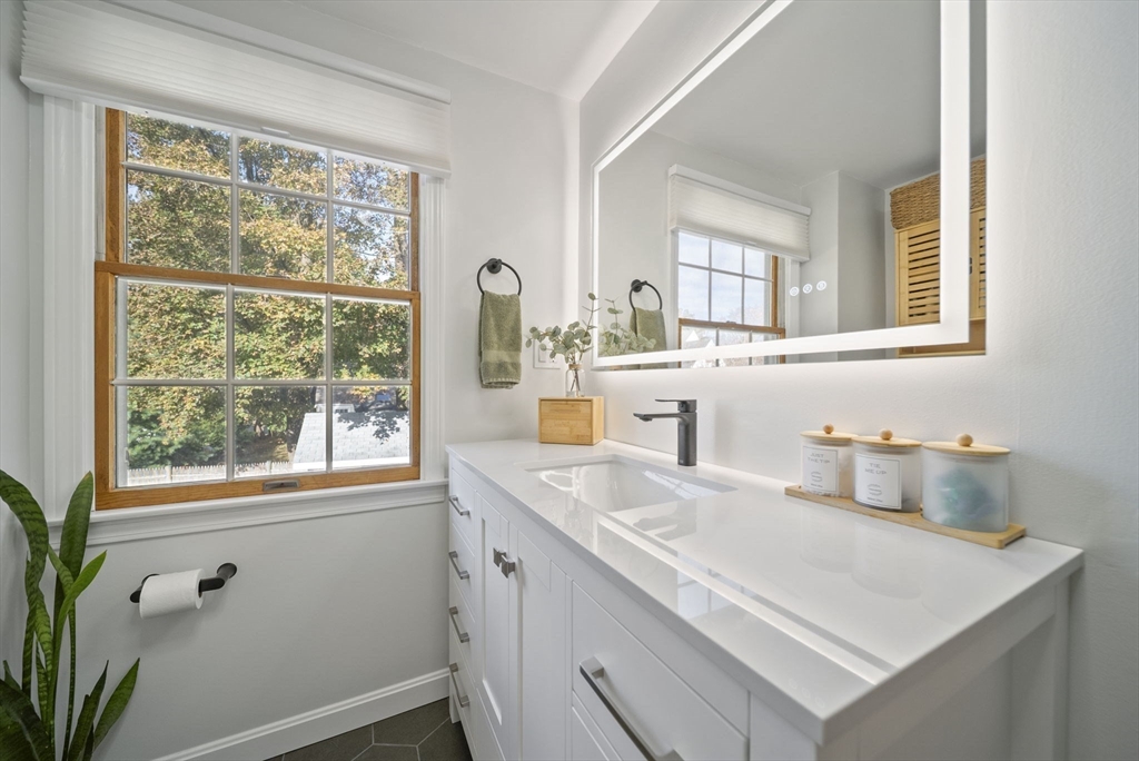 33 Ritchie Road Lynn, MA 01904 - Photo 25 of 39 a bathroom with a sink and a window