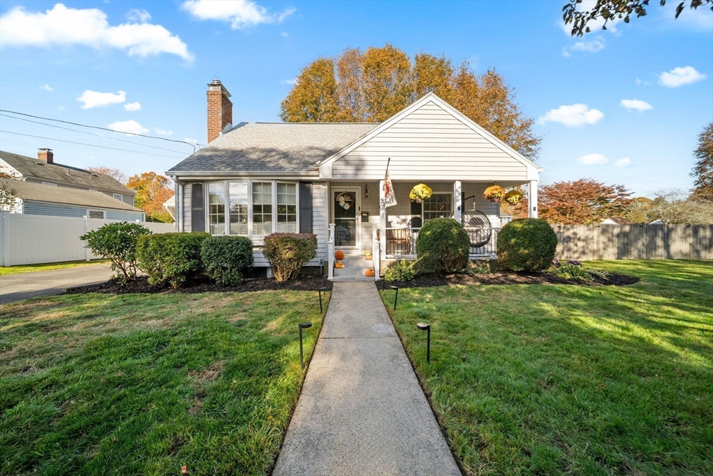 33 Ritchie Road Lynn, MA 01904 - Photo 3 of 39 a front view of a house with a garden