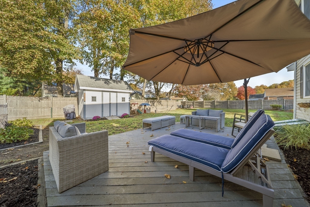 33 Ritchie Road Lynn, MA 01904 - Photo 32 of 39 an outdoor sitting area with furniture and umbrella