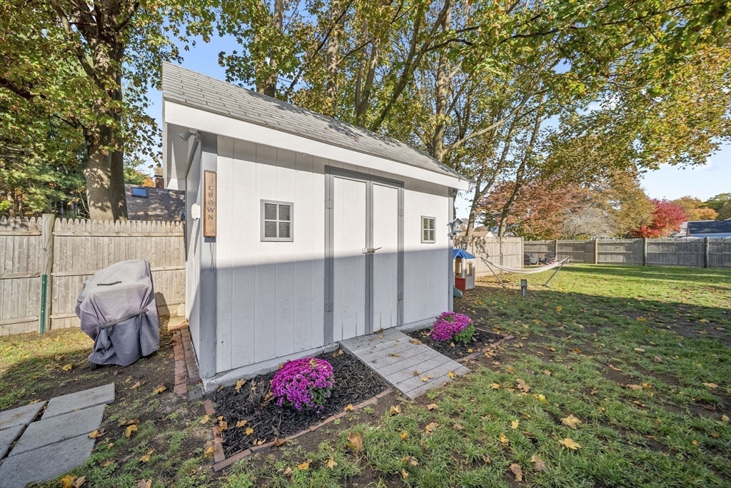 33 Ritchie Road Lynn, MA 01904 - Photo 34 of 39 a view of backyard with a table and chairs and potted plants
