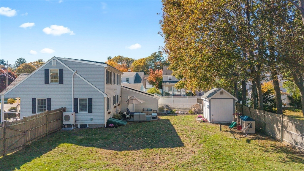 33 Ritchie Road Lynn, MA 01904 - Photo 35 of 39 a view of a house with backyard and a tree