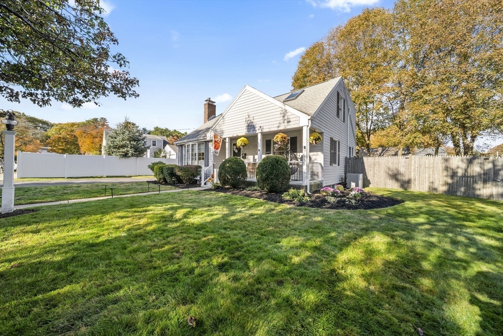 33 Ritchie Road Lynn, MA 01904 - Photo 38 of 39 a view of a house with a big yard and large trees