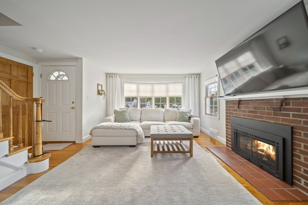 33 Ritchie Road Lynn, MA 01904 - Photo 5 of 39 a living room with furniture and a fireplace