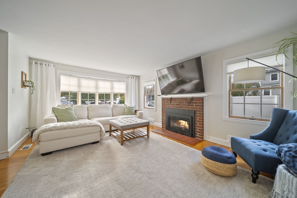 33 Ritchie Road Lynn, MA 01904 - Photo 7 of 39 a living room with furniture and a fireplace