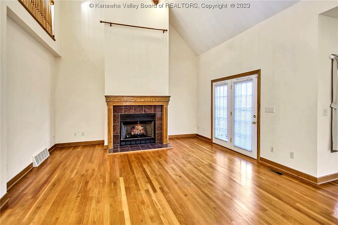1625 Stonehenge Road Charleston, WV 25314 - Photo 16 of 50 Open great room with tall vaulted ceilings and gas fireplace which could be also switched to wood.