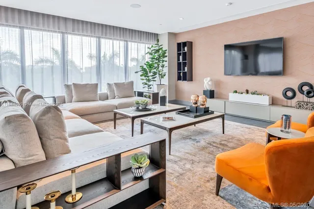 a kitchen with a dining table chairs sink and stove