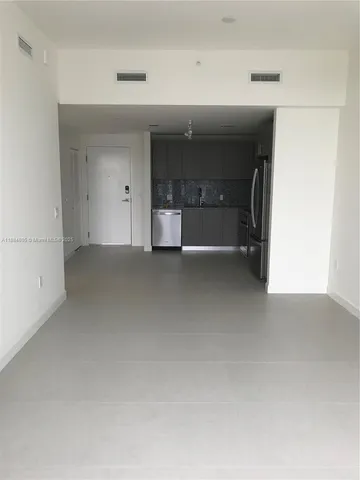 a kitchen with a refrigerator sink and stove