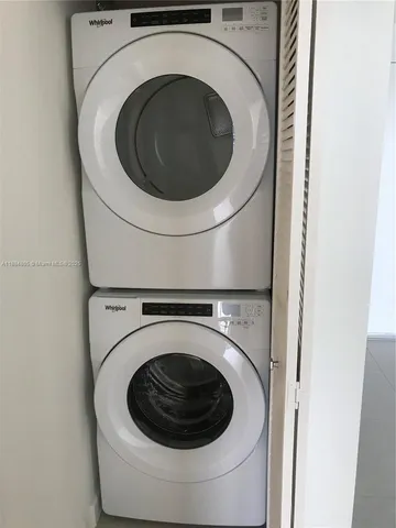 a view of a patio with couches table and chairs and potted plants