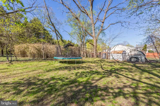 a view of yard with swimming pool