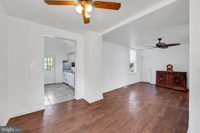 wooden floor in an empty room with a workspace