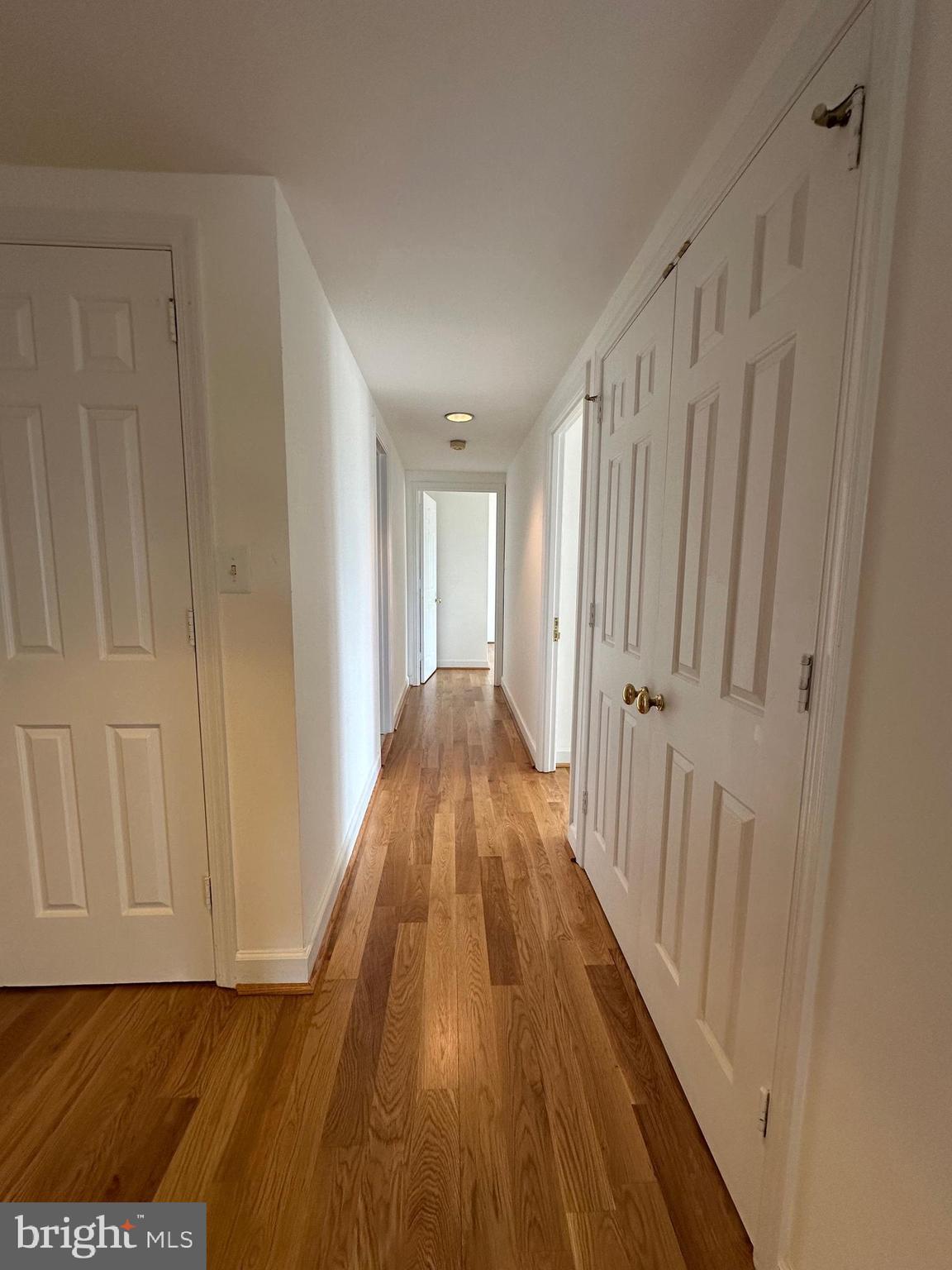 1080 Wisconsin Avenue Northwest, Unit 503W Washington, DC 20007 - Photo 10 of 36 a view of a hallway with wooden floor