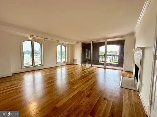a kitchen with a sink and a mirror