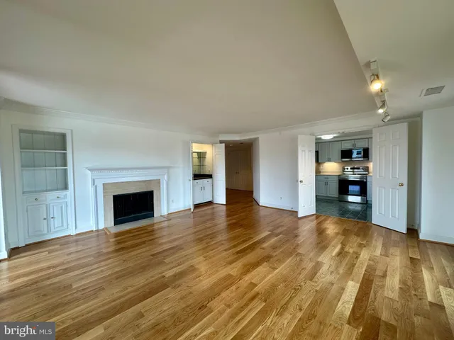 a kitchen with stainless steel appliances a stove microwave and refrigerator