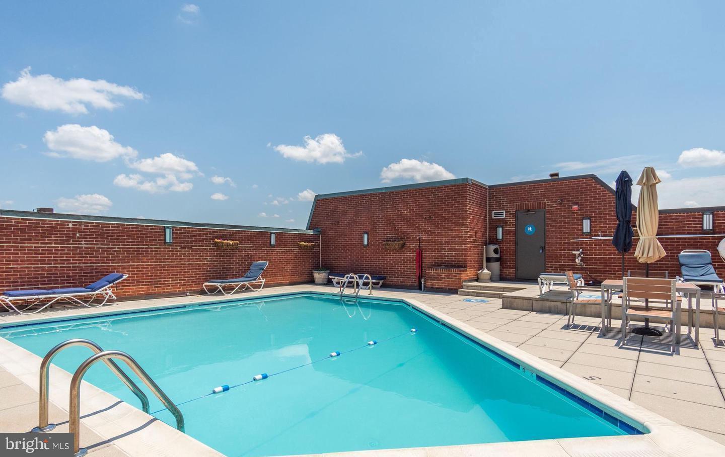 1080 Wisconsin Avenue Northwest, Unit 503W Washington, DC 20007 - Photo 32 of 36 a view of swimming pool with a lounge chair
