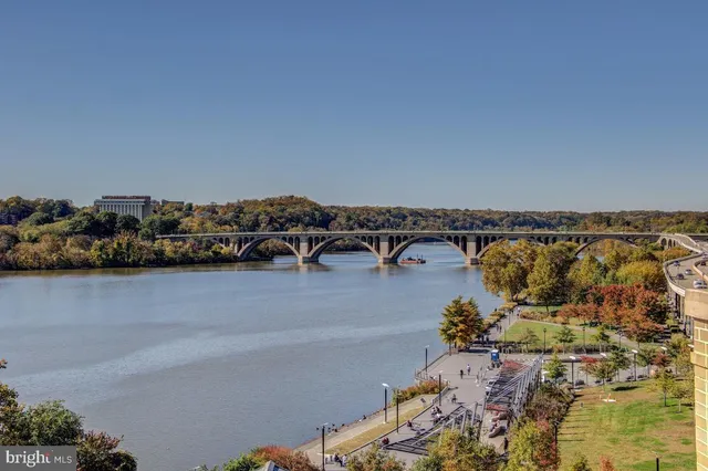 a city street lined with buildings and cars