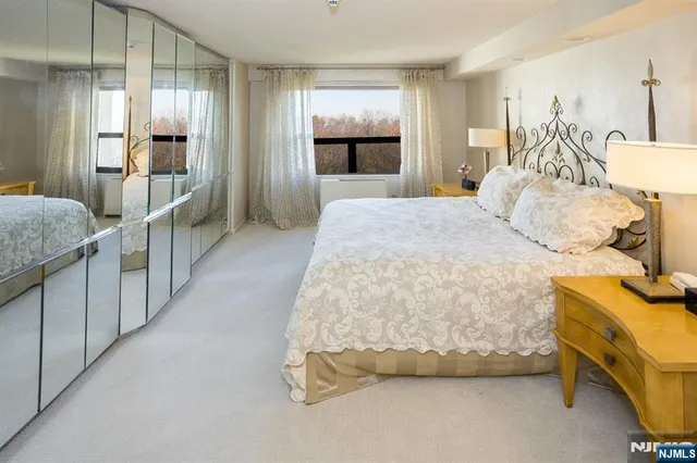 a bedroom with a bed and a view kitchen