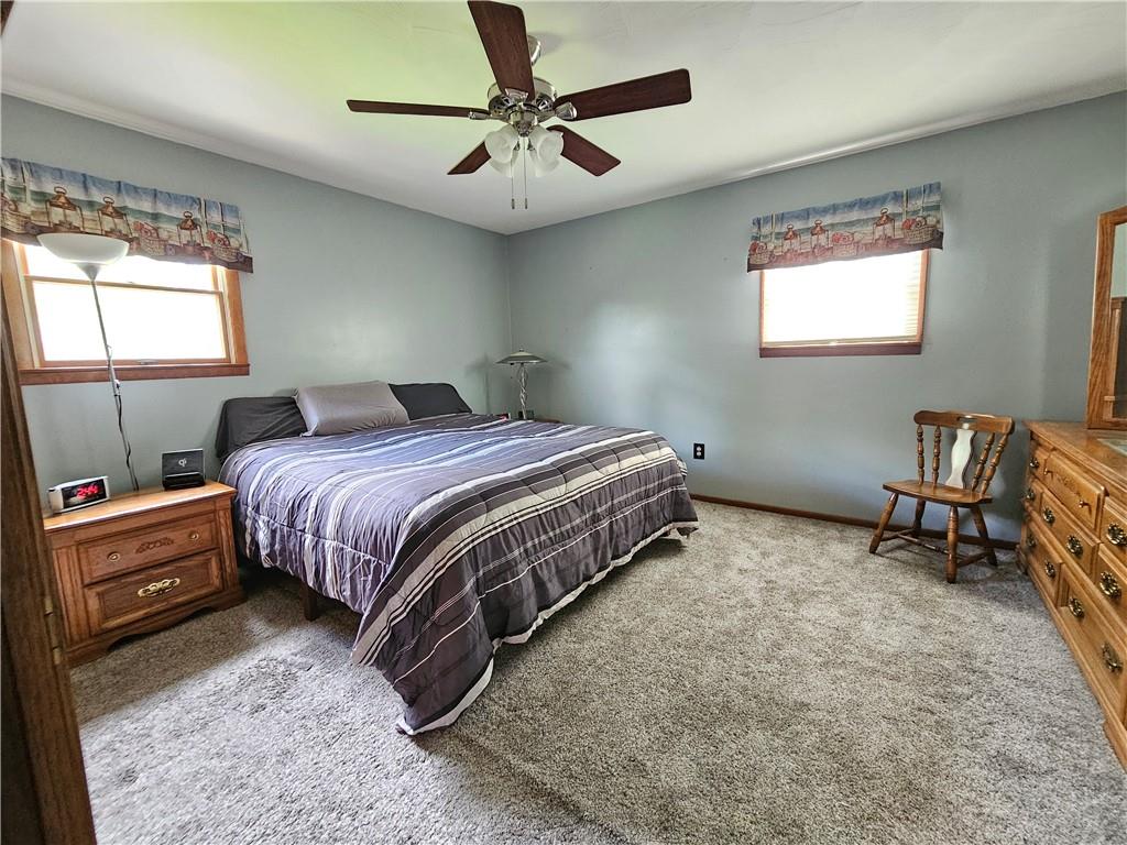 323 Hoon Road Butler, PA 16001 - Photo 13 of 49 a bedroom with a bed a table and chair