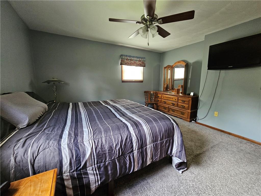 323 Hoon Road Butler, PA 16001 - Photo 14 of 49 a bedroom with a bed and a flat screen tv