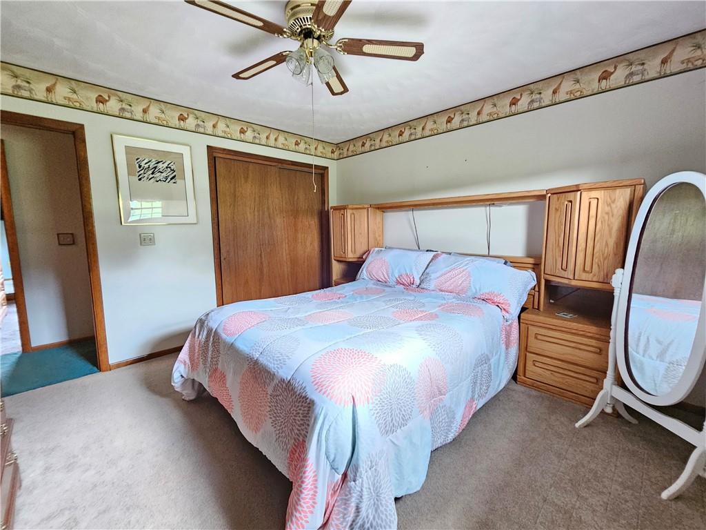 323 Hoon Road Butler, PA 16001 - Photo 16 of 49 a bedroom with a bed and wooden floor