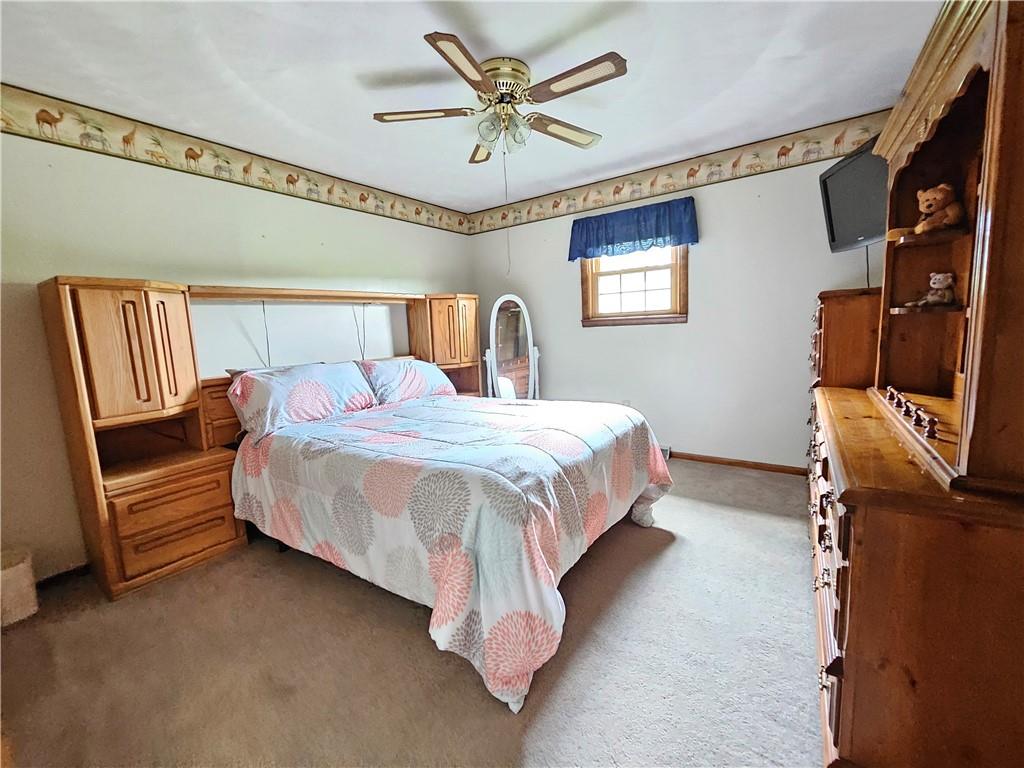 323 Hoon Road Butler, PA 16001 - Photo 17 of 49 a bed room with a bed and a television