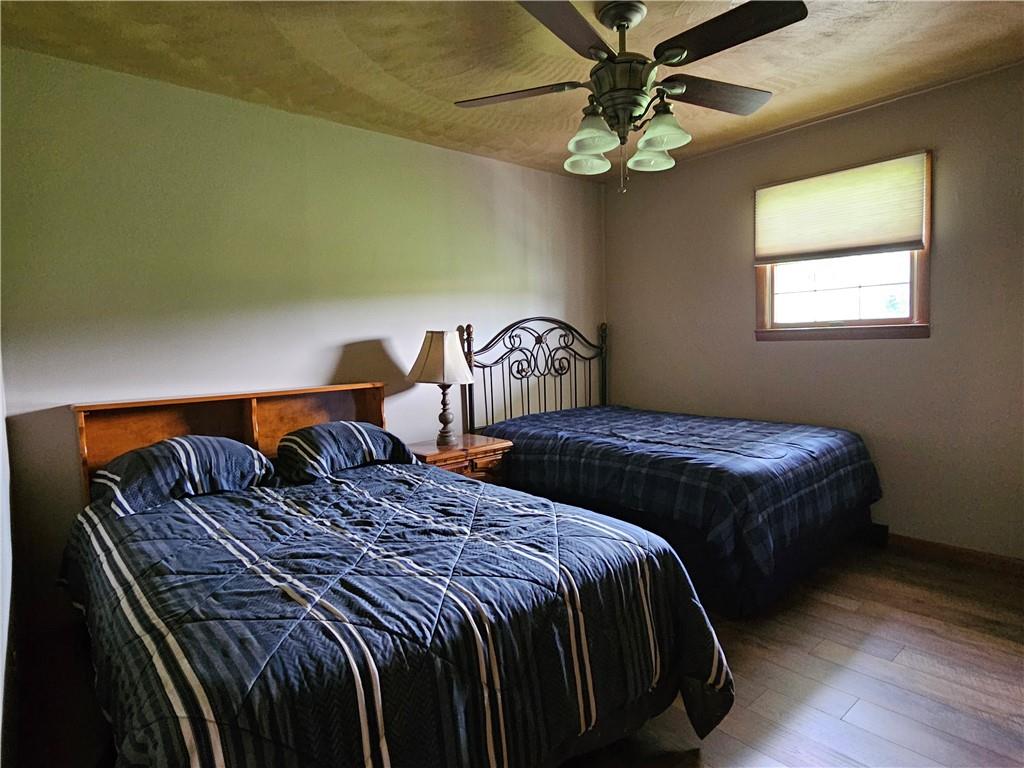 323 Hoon Road Butler, PA 16001 - Photo 18 of 49 a bedroom with double bed and a chandelier