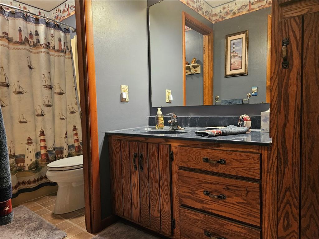 323 Hoon Road Butler, PA 16001 - Photo 19 of 49 a bathroom with a sink a toilet and shower