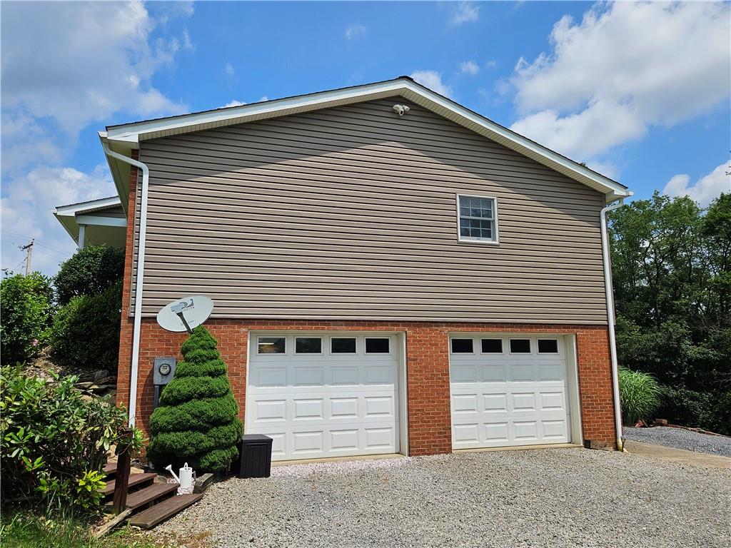 323 Hoon Road Butler, PA 16001 - Photo 4 of 49 a front view of a house with a yard