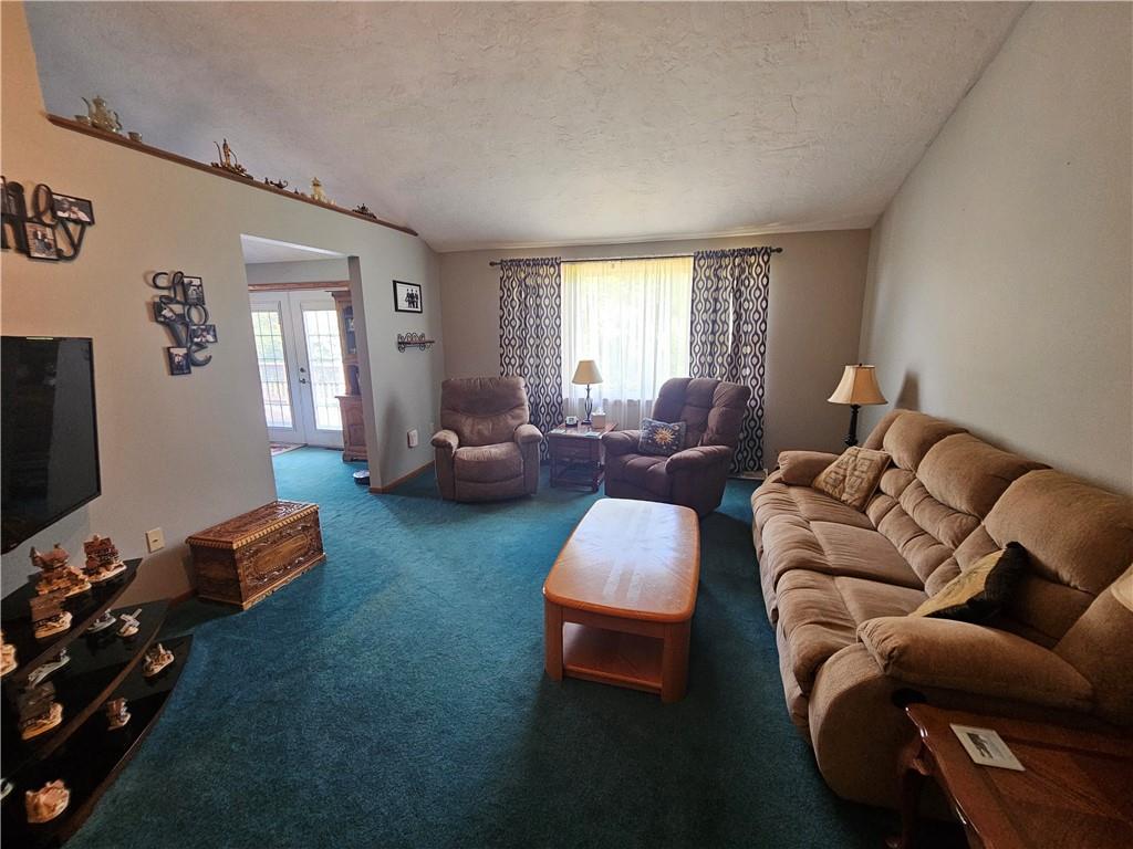 323 Hoon Road Butler, PA 16001 - Photo 45 of 49 a living room with furniture a flat screen tv and a window