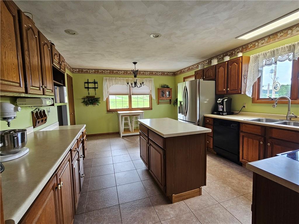 323 Hoon Road Butler, PA 16001 - Photo 6 of 49 a kitchen with a stove sink and cabinets