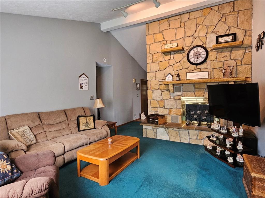 323 Hoon Road Butler, PA 16001 - Photo 8 of 49 a living room with furniture and a flat screen tv