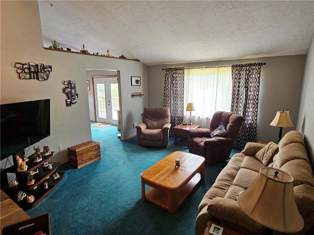 323 Hoon Road Butler, PA 16001 - Photo 9 of 49 a living room with furniture and a flat screen tv