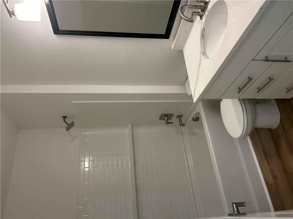 217 Bellflower Lane Anderson, SC 29625 - Photo 7 of 27 A well-appointed bath features a tiled shower and vanity with sink.