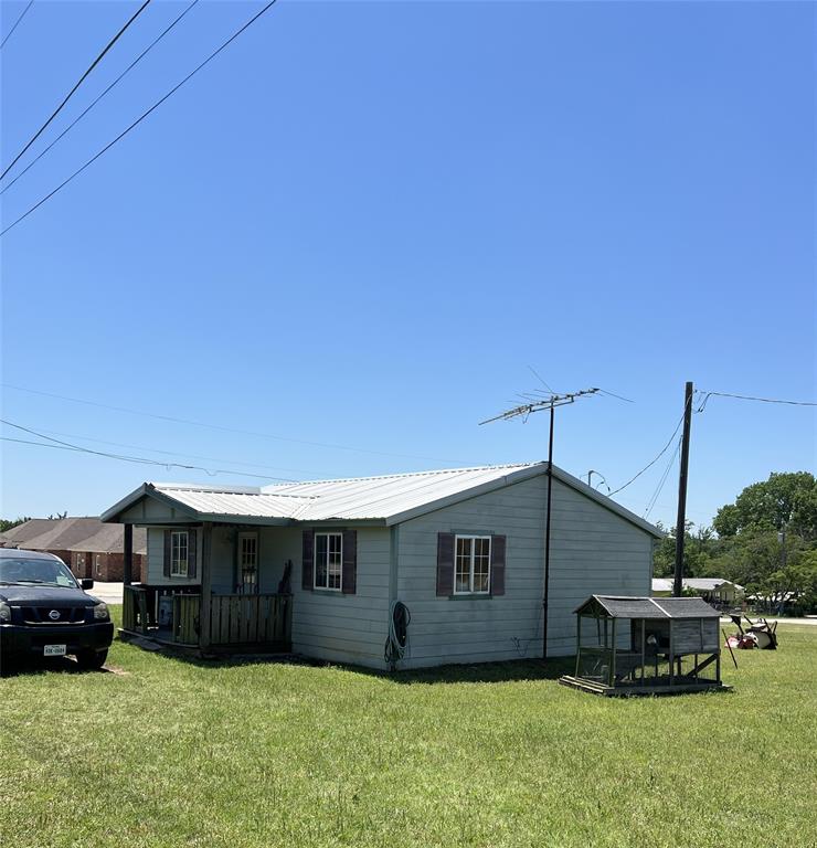 501 Captains Cut Oak Ridge, TX 76240 - Photo 1 of 1 a house view with a sitting space and garden