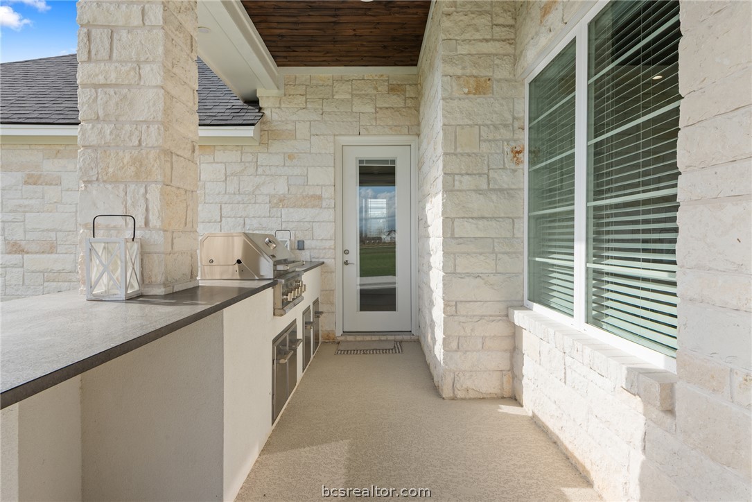 7844 Mathis Crk Drive Bryan, TX 77808 - Photo 46 of 48 a bathroom with a granite countertop sink and washing machine
