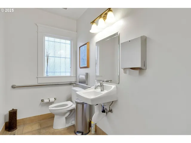 a view of living room with furniture and a window