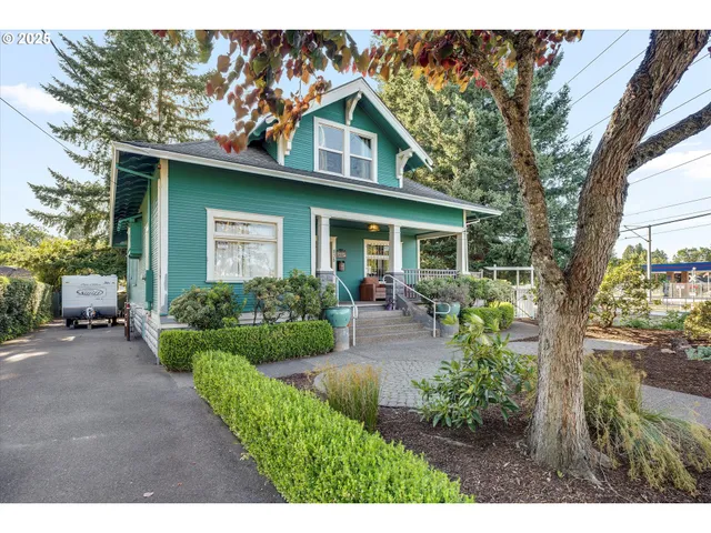 a front view of a house with garden